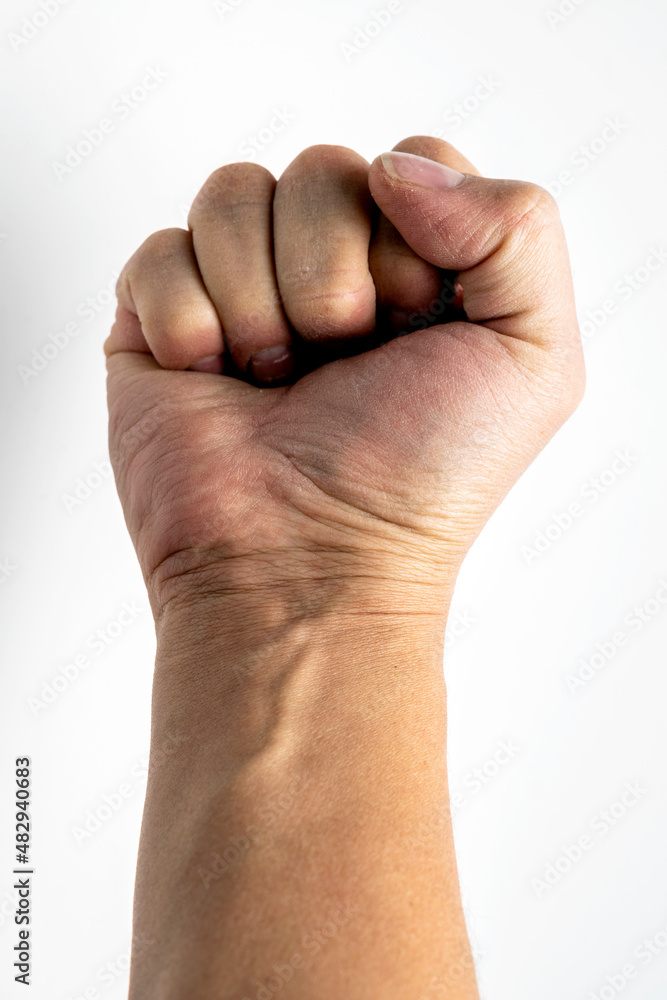 Worker's hand clenched into a fist Worker's hand clenched into a fist