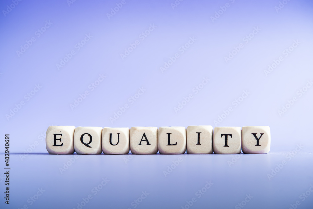 Equality between men and women, gender equality, non-discrimination. Word of equality on a purple background. Feminism Equality between men and women, gender equality, non-discrimination. Word of equality on a purple background. Feminism