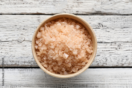 Bowl of sea salt on light w...