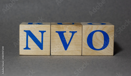 January 19, 2022. New York, USA. Stock Ticker symbol of Novo Nordisk NVO made of wooden cubes on a gray background. photo