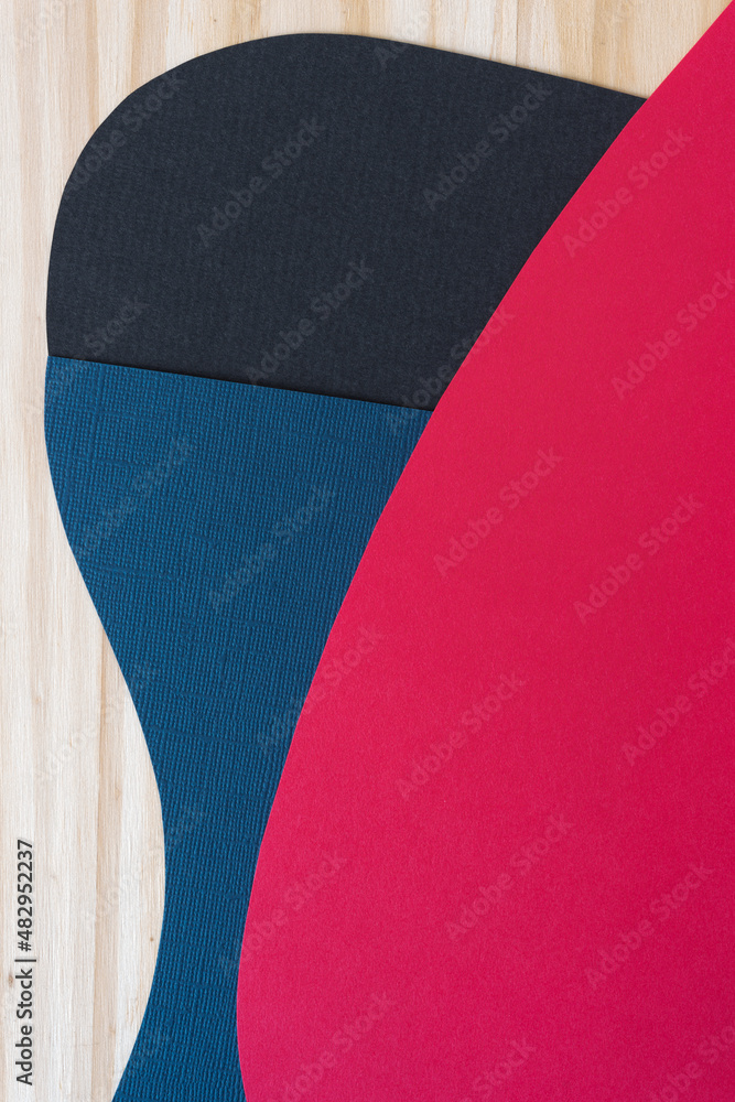 paper background in red, blue, and black on wood paper background in red, blue, and black on wood