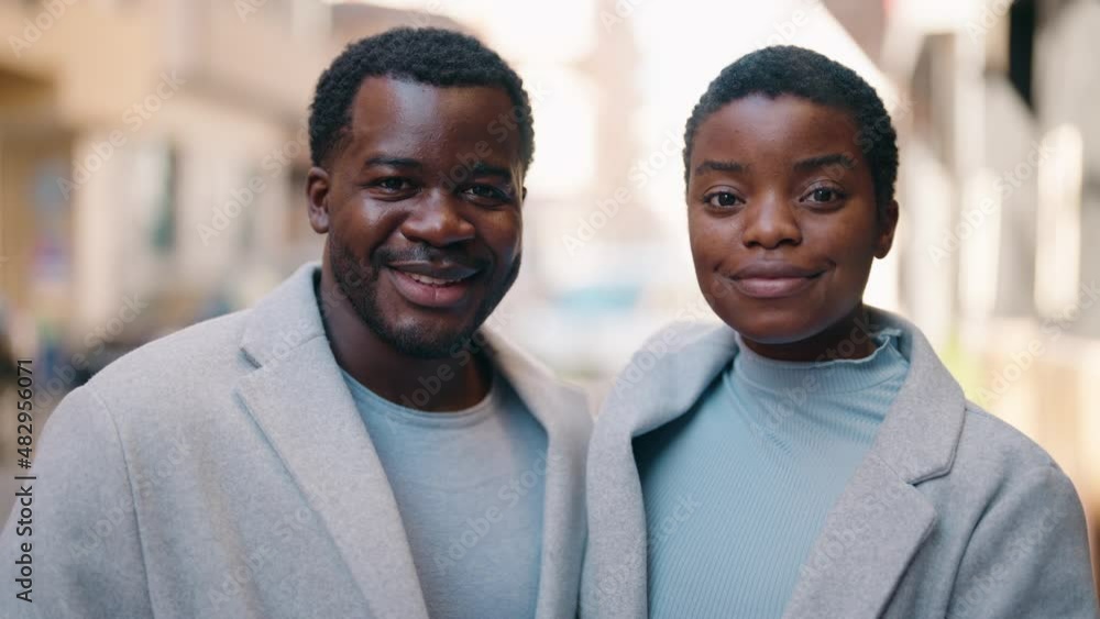 African american couple smiling confident hugging each other at street African american couple smiling confident hugging each other at street
