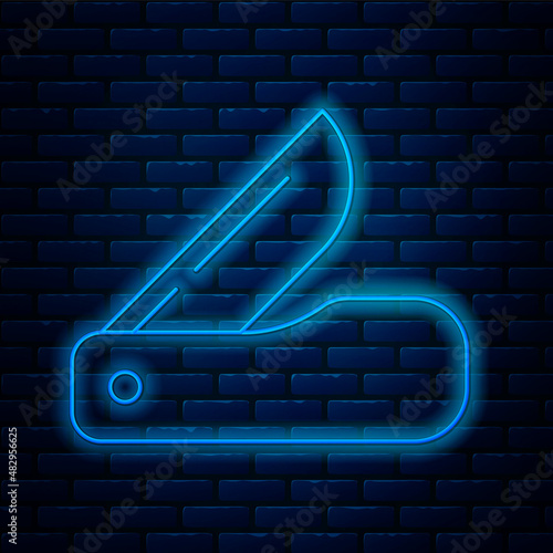Glowing neon line Swiss army knife icon isolated on brick wall background. Multi-tool, multipurpose penknife. Multifunctional tool. Vector