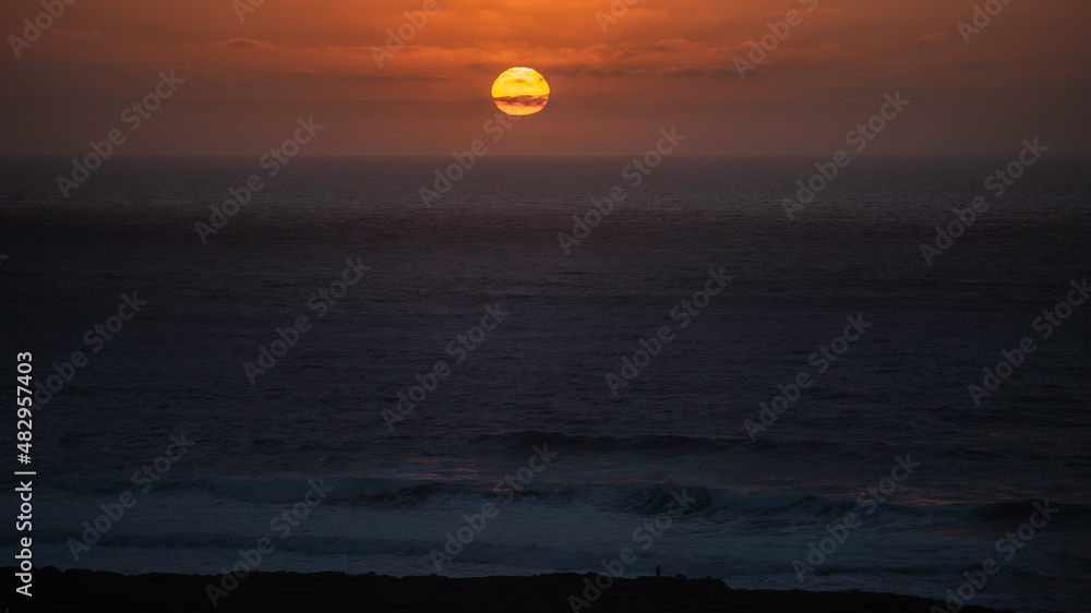 Beautiful sunset seen from the Pacific ocean coastline 