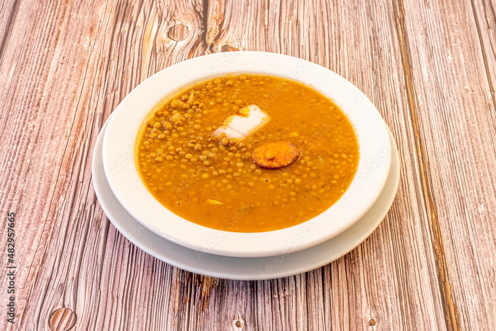 Lentils with chorizo are a traditional stewed culinary preparation from the province of Ávila. The popularity of the Spanish cuisine dish with various variants of meat from the slaughter Lentils with chorizo are a traditional stewed culinary preparation from the province of Ávila. The popularity of the Spanish cuisine dish with various variants of meat from the slaughter
