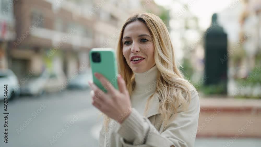Young blonde woman smiling confident having video call at street Young blonde woman smiling confident having video call at street