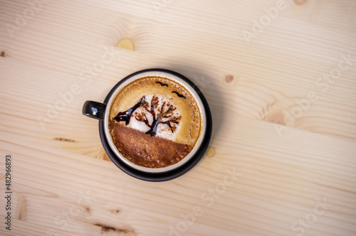 Artist draw coffee on table with wood background and coffee beans
