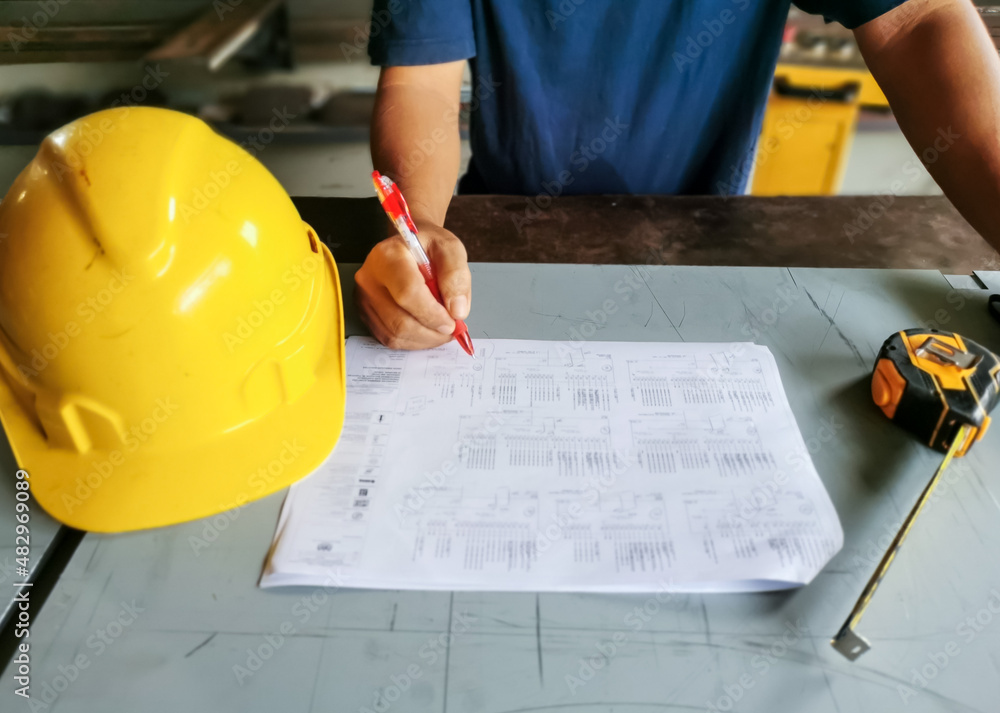 Man at work in factory. Work planning by supervisor or manager. Man at work in factory. Work planning by supervisor or manager.