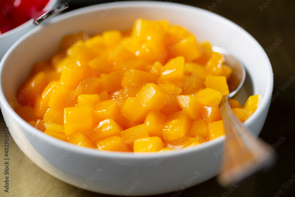 A view of bowl of canned peaches. A view of bowl of canned peaches.