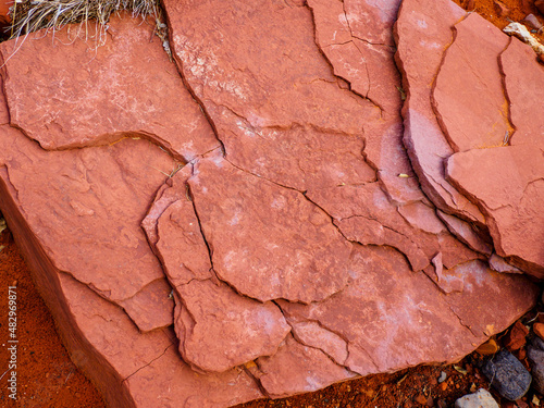 Exfoliating thin layers of red sandstone photo