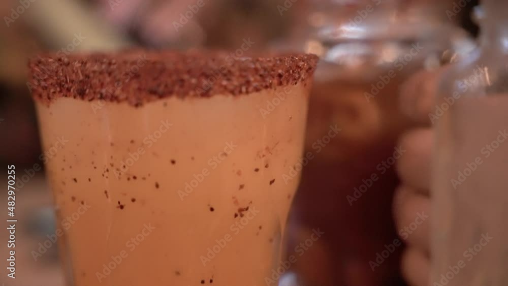 Close up of a traditional Mexican alcoholic beverage, michelada Close up of a traditional Mexican alcoholic beverage, michelada