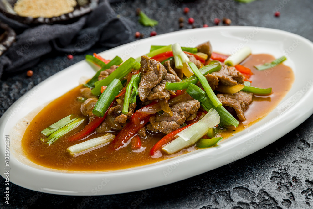 Fried beef with vegetables and pepper Chinese cuisine Fried beef with vegetables and pepper Chinese cuisine