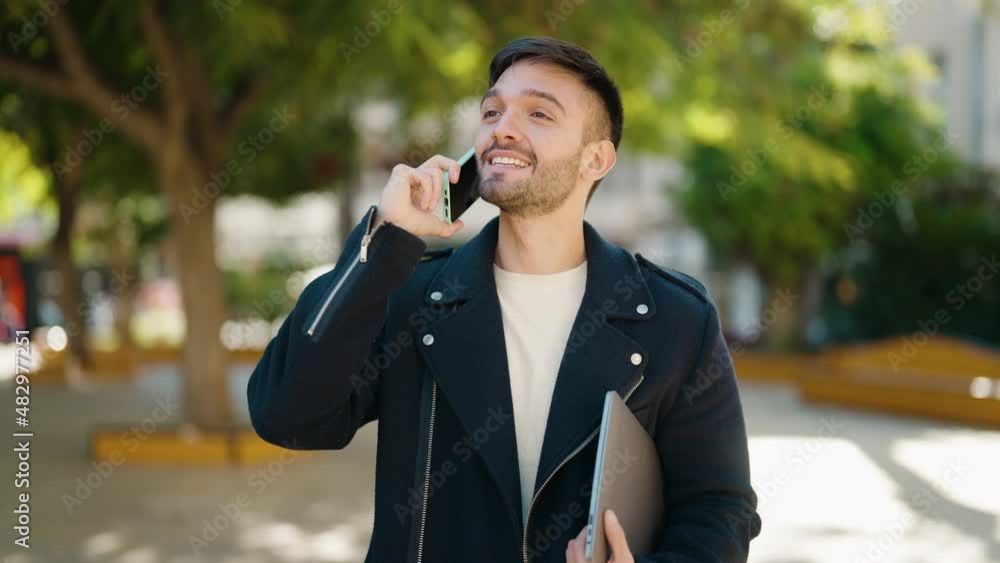 Young hispanic man smiling confident talking on the smartphone at park Young hispanic man smiling confident talking on the smartphone at park