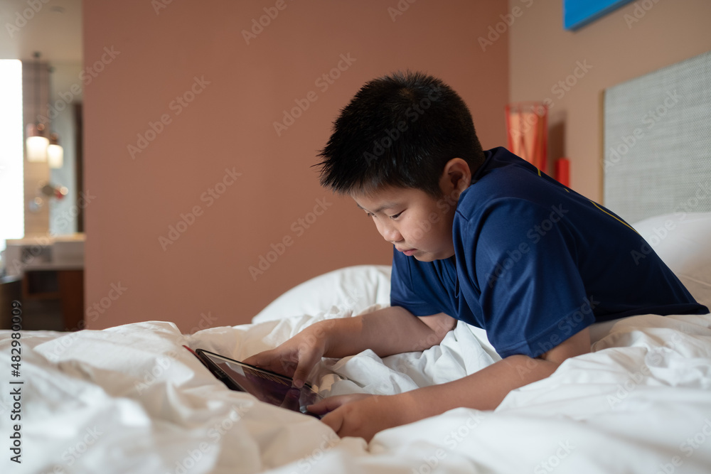 kid watching tablet, boy addicted cartoon kid watching tablet, boy addicted cartoon