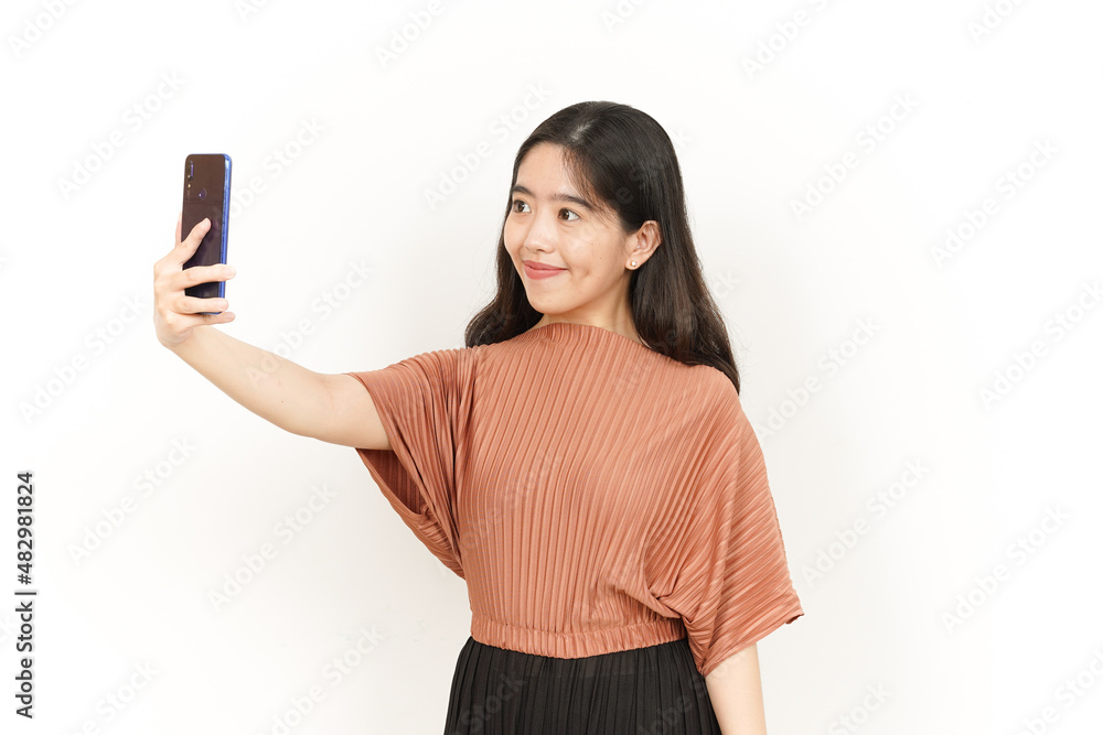 Take a Selfie Of Beautiful Asian Woman Isolated On White Background Take a Selfie Of Beautiful Asian Woman Isolated On White Background
