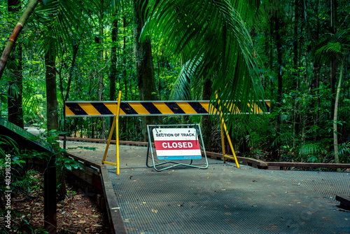 Slika na platnu Road Closed sign blocking the road to a walking track in a forest