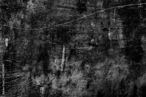 Old abandoned dark concrete floor surface with scratches and spots for texture background