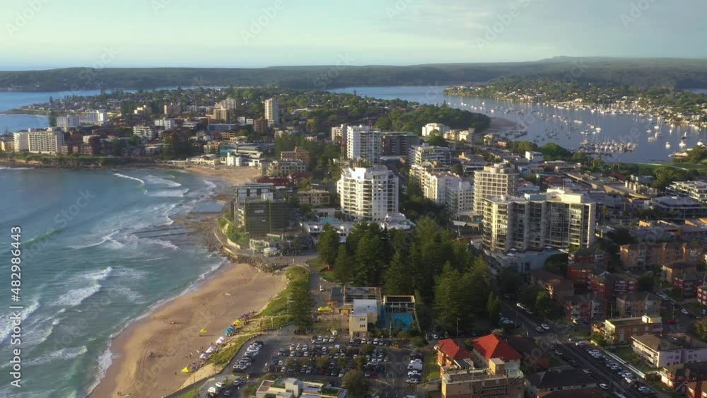 Aerial drone flyover of Cronulla in the Sutherland Shire, South Sydney, traveling south toward Port Hacking during summer in the early morning Aerial drone flyover of Cronulla in the Sutherland Shire, South Sydney, traveling south toward Port Hacking during summer in the early morning