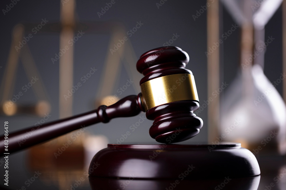 Law symbols composition. Law and justice concept. Gavel and scale on gray background. Law symbols composition. Law and justice concept. Gavel and scale on gray background.