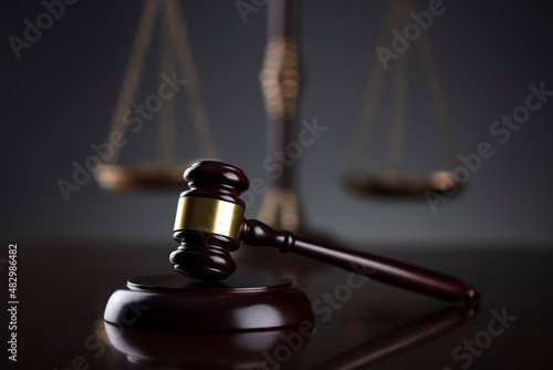 Law symbols composition. Law and justice concept. Gavel and scale on gray background.