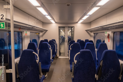 Modern train inside interior. Blue seats