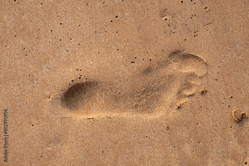 single step on the sand.