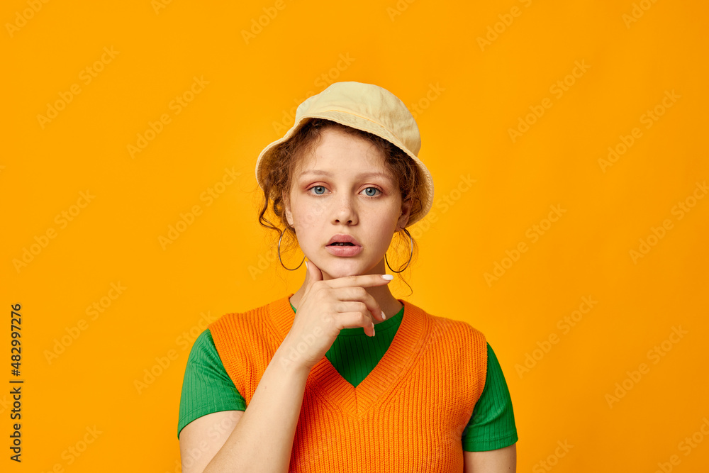cute girl wearing hat posing orange sweater isolated background cute girl wearing hat posing orange sweater isolated background