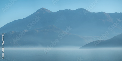 Seascape with mist . Sea Mediterranean landscape with mountains and fjords. Vacation recreation holiday travel adventure concept. blue water seascape background © Celt Studio