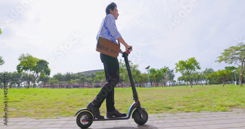 man riding electric scooter