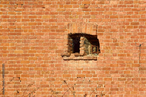 a window like an embrasure in a brick wall photo