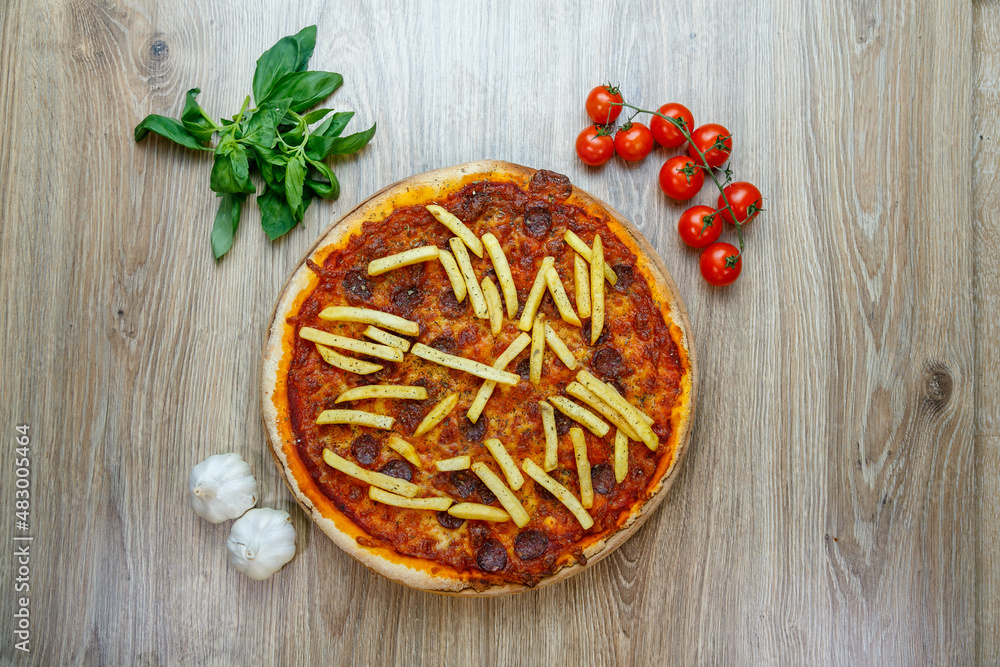 pizza with hot sausage and french fries on tomato sauce pizza with hot sausage and french fries on tomato sauce