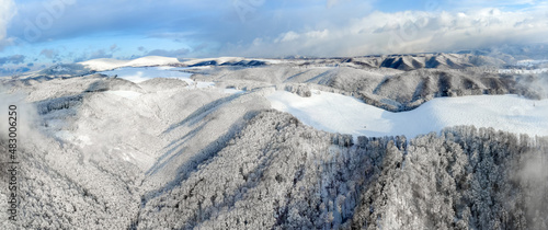 a beautiful aerial landscape with the Calimani mountains in winter