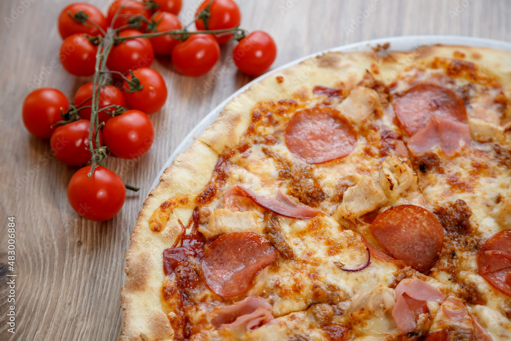 pizza with chicken breast, mozzarella, salami and white sauce pizza with chicken breast, mozzarella, salami and white sauce