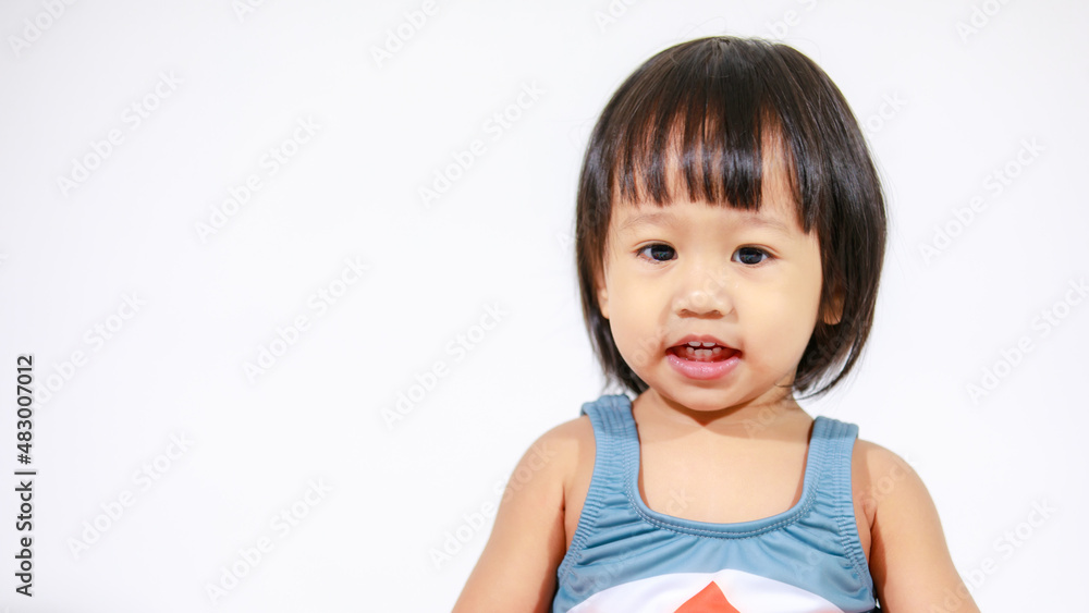 Studio shot of little beautiful kindergarten Asian baby girl daughter model in cute gray shark costume swimsuit outfit sitting on white background Studio shot of little beautiful kindergarten Asian baby girl daughter model in cute gray shark costume swimsuit outfit sitting on white background