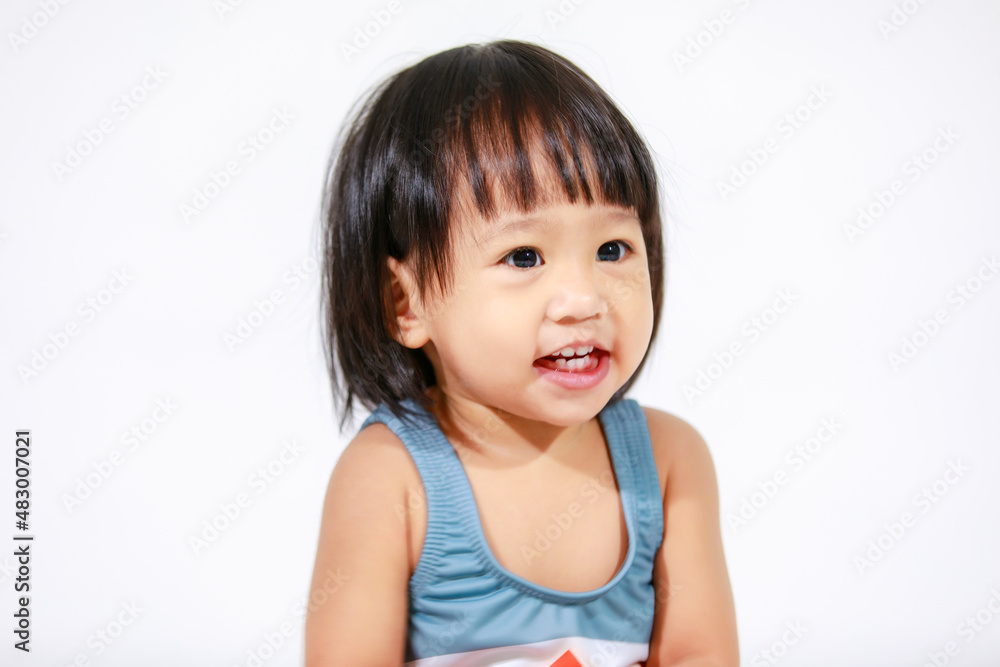 Studio shot of little beautiful kindergarten Asian baby girl daughter model in cute gray shark costume swimsuit outfit sitting on white background Studio shot of little beautiful kindergarten Asian baby girl daughter model in cute gray shark costume swimsuit outfit sitting on white background