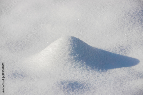 a close-up with a snow dune
