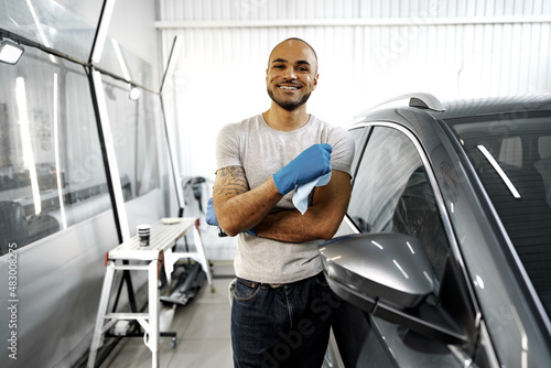 Portrait of African American man, car wash detailing service worker © fotofabrika
