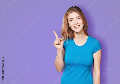 Photo of young woman happy indicate finger empty space recommend