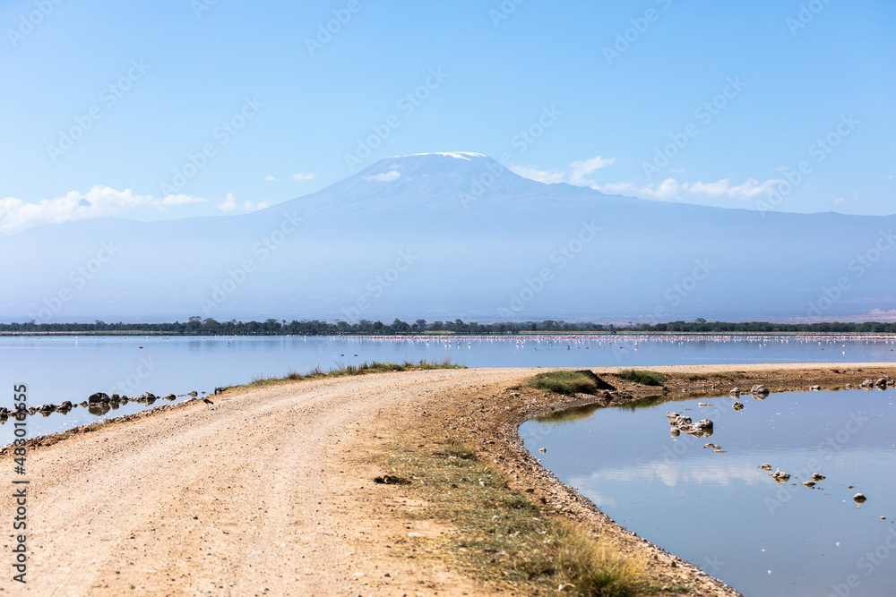 A narrow road goes between lakes in Amboseli National Park, Kenya