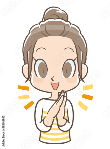 手を合わせて喜ぶ団子頭の女の子