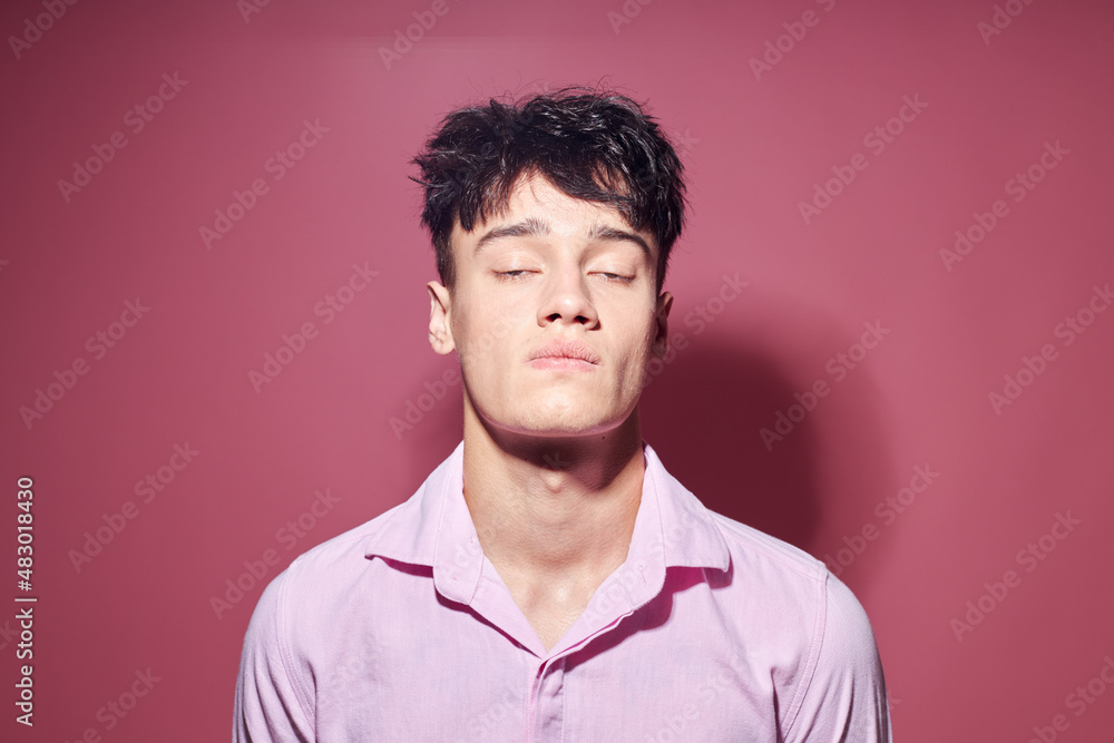 pretty man gestures with hands emotions hairstyle fashion isolated background unaltered pretty man gestures with hands emotions hairstyle fashion isolated background unaltered