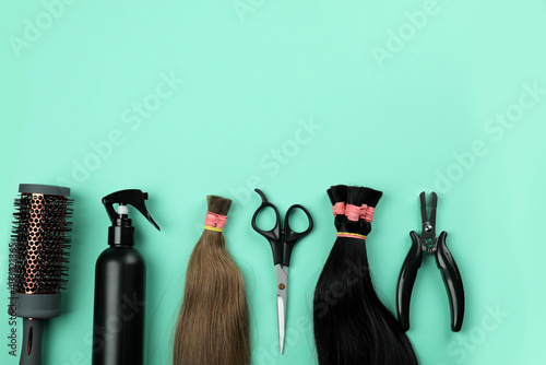 Composition with hair extension accessories on mint background