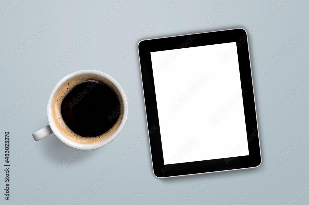 tablet computer with a cup of tea or coffee. concept business or to do list goals tablet computer with a cup of tea or coffee. concept business or to do list goals