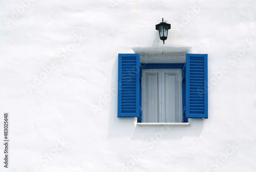  blue window on the white wall