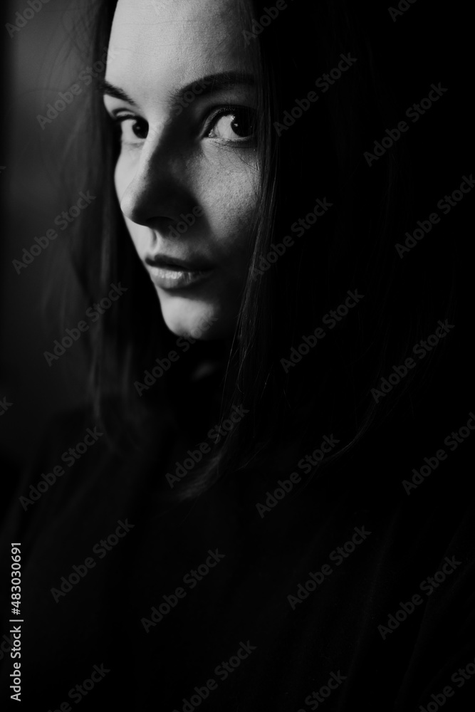 Black and white portrait of young beautiful woman in profile Black and white portrait of young beautiful woman in profile