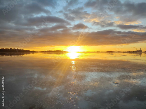 Spectacular sunset over  frozen lake in the Sweden in winter