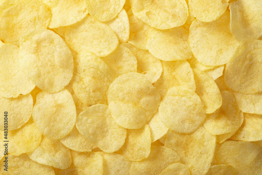 Full frame foodbackground of potato chips, top view Full frame foodbackground of potato chips, top view