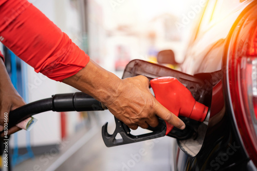 Obraz na plátně Refueling the car at a gas station fuel pump