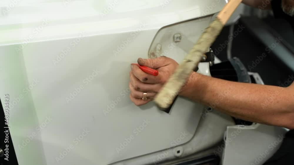 Video Process Of Repairing Dent On Car Rear Fender Surface in Car Repair Shop. Technician Is Fix Damaged Car Body After AccidentUsing Tools. Video Process Of Repairing Dent On Car Rear Fender Surface in Car Repair Shop. Technician Is Fix Damaged Car Body After AccidentUsing Tools.