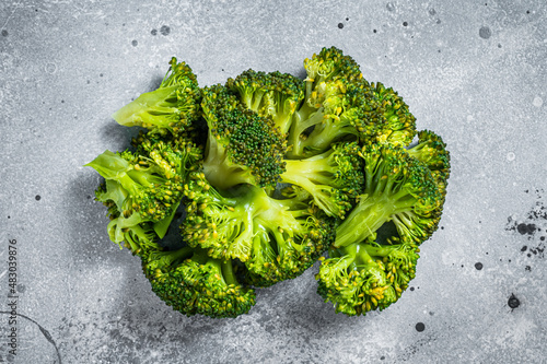 Green boiled broccoli cabbage on kitchen table. Gray background. Top view